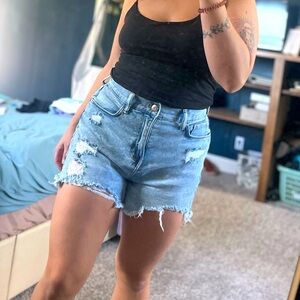 Light washed distressed blue jeans